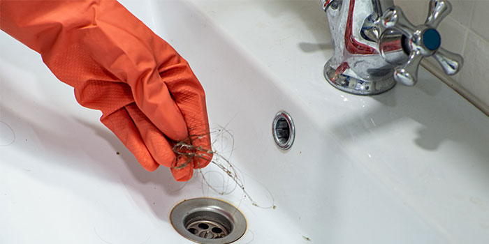 Team removing clogs and debris in Dubai